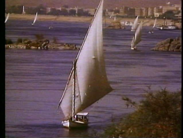 ASWAN, EGYPT, 1977, The Nile River, feluccas, sailboats, wide shot, many boats