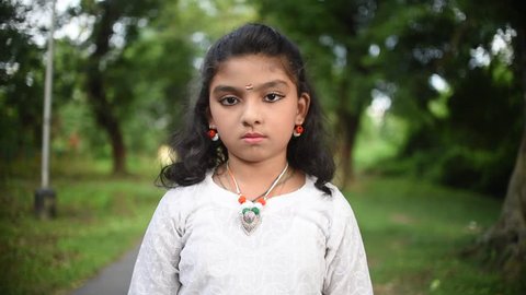 A little cute Indian girl disapproves something, disagrees, saying No to something, Slow motion, South Asian