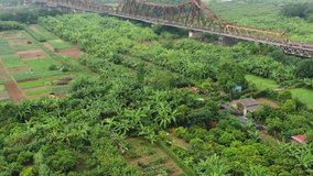 Aerial view by flycam of The Long Bien railway bridge crossing the Red River in Hanoi, was constructed by Gustave Eiffel in 1903,the first steel bridge across the Red River,