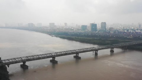 Aerial view by flycam of The Long Bien railway bridge crossing the Red River in Hanoi, was constructed by Gustave Eiffel in 1903,the first steel bridge across the Red River,