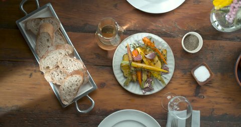 Thanksgiving dinner spread with turkey being cut, carrot sides and bread in ultra slow motion closeup with 4k Phantom Flex camera Stock Video