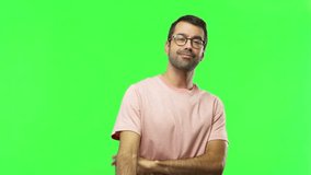 Man on green screen chroma key background showing ok sign with fingers