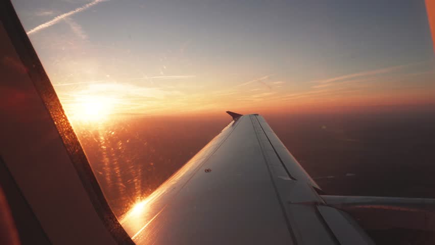 Sun Flare Over Airplane Window, Passenger POV View