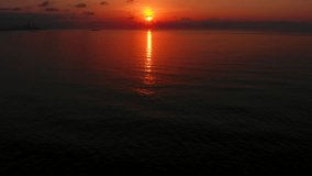 Beautiful red sunset sky above Black Sea, Georgia. Aerial video, 4K. 