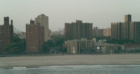 Aerial view of staten island coastal town in New York at golden hour. Wide to Long shot on 4K RED camera.