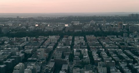 Aerial view of Manhattan Central Park in New York at pink sunset. Wide to Long shot on 4K RED camera.