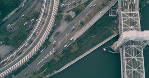 Aerial top down view of Manhattan highway in New York at pink sunset. Wide to Long shot on 4K RED camera.