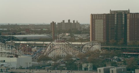 Aerial view of staten island amusement park in New York at golden hour. Wide to Long shot on 4K RED camera.