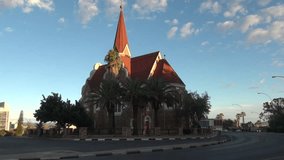 HD high quality summer day video footage of the 1910 Lutheran German-built Christuskirche Christ Church located on a hill near city center of Windhoek, the capital of Namibia, southern Africa