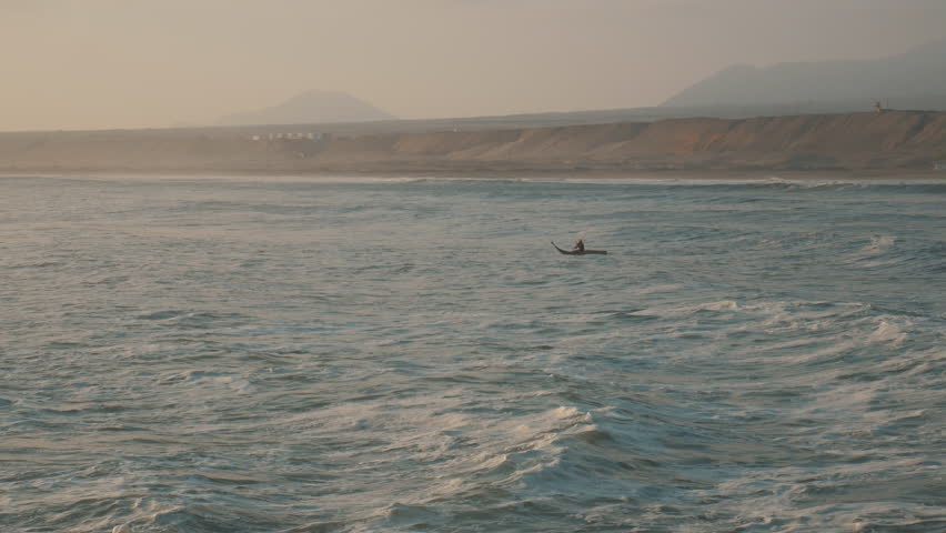 Peruvian Fisherman Paddling with Traditional Reed Boat in Huanchaco, Trujillo 2