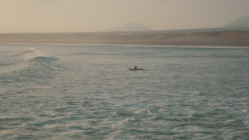 Peruvian Fisherman Paddling with Traditional Reed Boat in Huanchaco, Trujillo 3