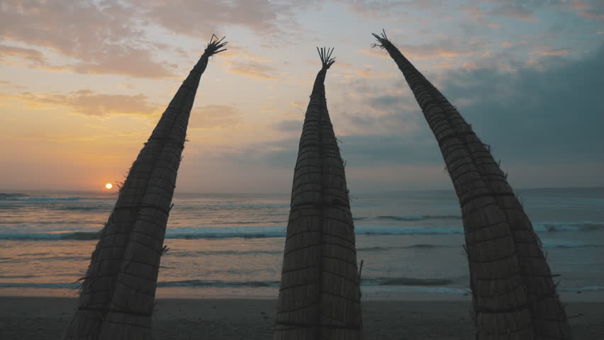 Traditional Peruvian Reed Boat « Caballito de Totora » with Sunset, Huanchaco Beach