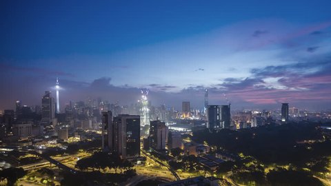 4k UHD time lapse of sunrise night to day scene at Kuala Lumpur city skyline. 
Tilt down