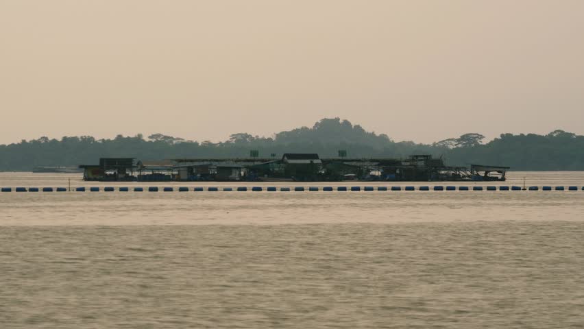 Time Lapse of a Kelong Floating Settlement off the Coast of Singapore at Sunrise