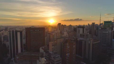 SAO PAULO, BRAZIL - MAY 3, 2018: Aerial view of city centre on sunset, residental and business buildings in downtown from above. Drone shot in 4K