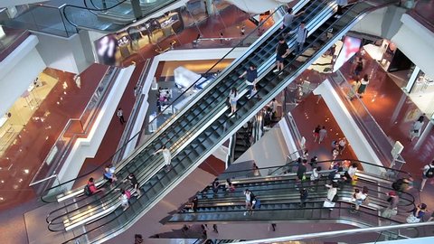 HONG KONG, CHINA - CIRCA NOVEMBER, 2018: Time lapse escalators in modern shopping mall crowd of people. Very busy full of clients mall complex. Consumption concept