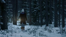 Woman with old lantern walking in snow covered wild forest in winter - Powered by Shutterstock - Get 15% off with code: PIKWIZARD15