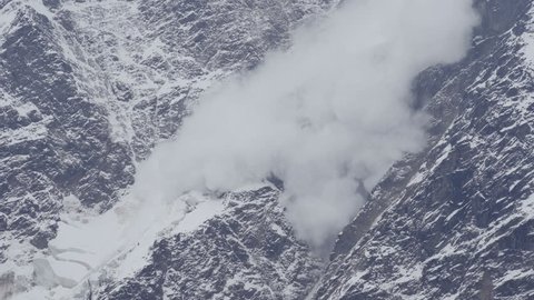 Avalanche is coming down a glacier in the Caucasus Mountains, Russia