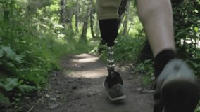 Disabled athlete with prosthetic leg running at the running track in the park - Powered by Shutterstock - Get 15% off with code: PIKWIZARD15