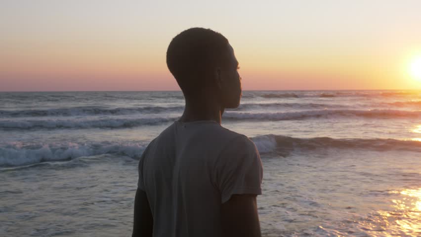 Lonely black migrant looking the sea.Immigration,Africa,refugee Royalty-Free Stock Footage #1019142841