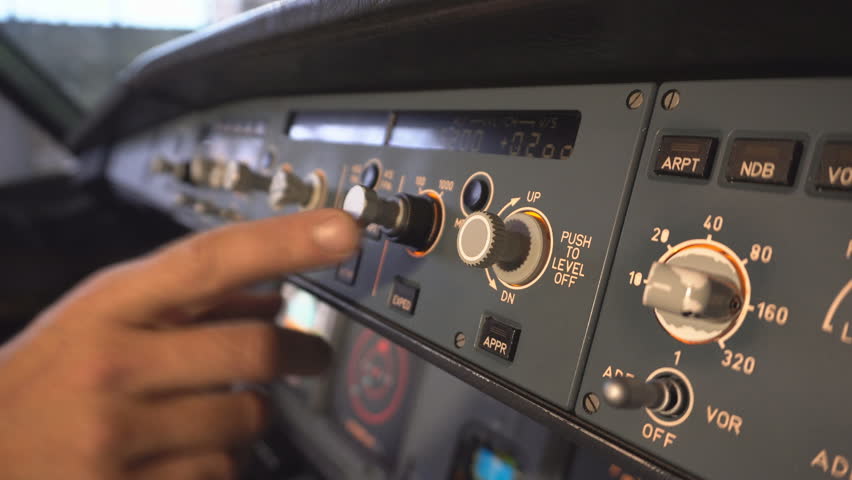 The cockpit of the aircraft. The pilot checks the plane before takeoff. Preparation of passenger airliner for takeoff. The pilot adjusts the autopilot. 4k Royalty-Free Stock Footage #1019145070