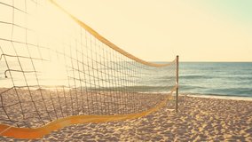 Volleyball net and beautiful sunrise on the beach