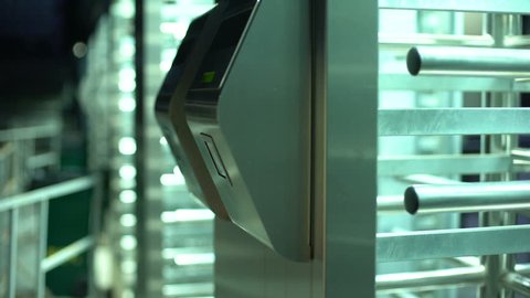 Man passing electronic turnstile, access control for business center, closeup