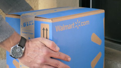 NEW YORK - OCT 8, 2018: Walmart box package delivery on October 8, 2018. Wal-Mart is the world's biggest retailer, 37 million people shop at Wal Mart every day. 