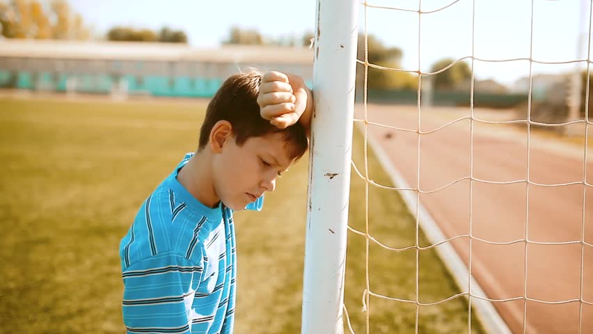 boy teenager soccer football player upset defeat insult sadness and anger. boy teenager grieved after the defeat. lifestyle well, managed to win. soccer kids concept Royalty-Free Stock Footage #1019161075