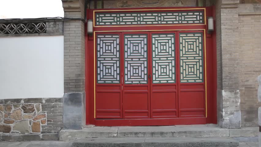 Chinese red door with ornaments and decoration at the Summer Palace in Beijing, China