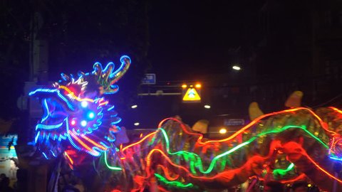Chinese dragon performing at night. Lunar new year celebration.