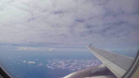 Plane flight above white clouds.Blue sky on background.
Beauty shot.