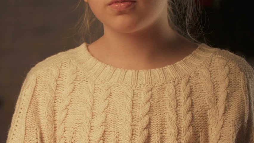 Parent giving gift to happy daughter, merry Christmas in childhood, closeup