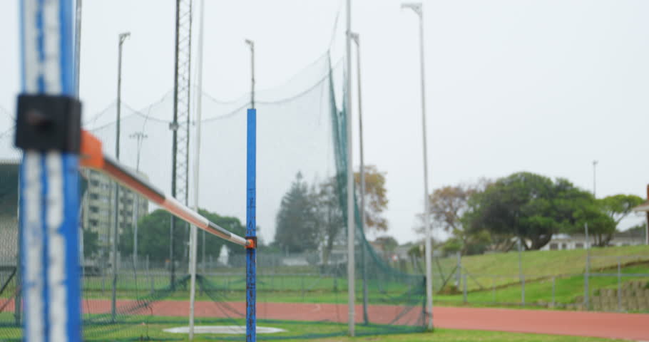 Young Caucasian female athlete using mobile phone at sports venue 4k