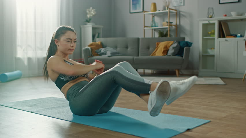 Busty teens in yoga pants Beautiful Confident Busty Fitness Girl In An Athletic Top Is Doing Abdominal Exercises In Her Bright And Spacious Apartment With Minimalistic Interior