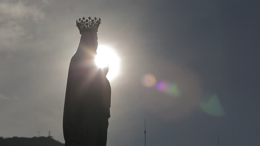 Sun behind the statue of the Madonna | Shutterstock HD Video #1019183953