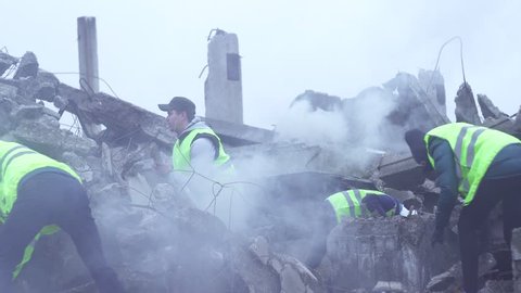 rescue workers dismantle the rubble after the earthquake