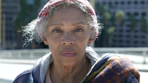 Portrait of an elderly African American homeless woman on the street - or, Immigration Portrait in America.