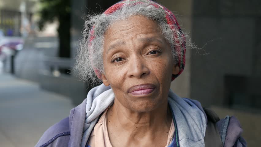 Portrait of emotional African American homeless woman looking in camera dejected.  Could also be used as a piece for immigration. Royalty-Free Stock Footage #1019201173