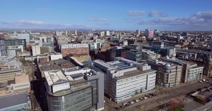 Aerial footage from above the River Clyde to Glasgow city centre. 