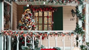 Porch christmas decoration with green New Year Tree and toys - Powered by Shutterstock - Get 15% off with code: PIKWIZARD15