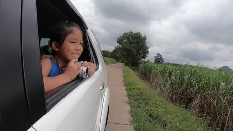 Little traveler take picture from window car, slow motion