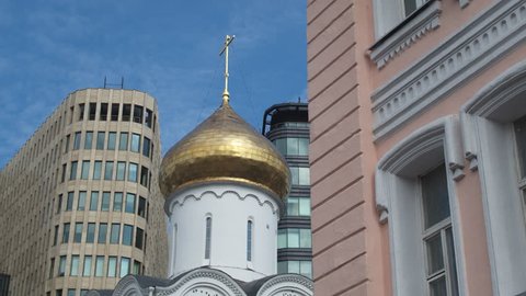 Orthodox church inside the financial district in the center of Moscow. Dolly shot