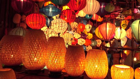 CLOSE UP Countless oriental lamps are lit up on a festive night in Vietnam. Beautiful shot of colorful lanterns during the full moon celebration in Hoi An. Idyllic shot of numerous traditional lights