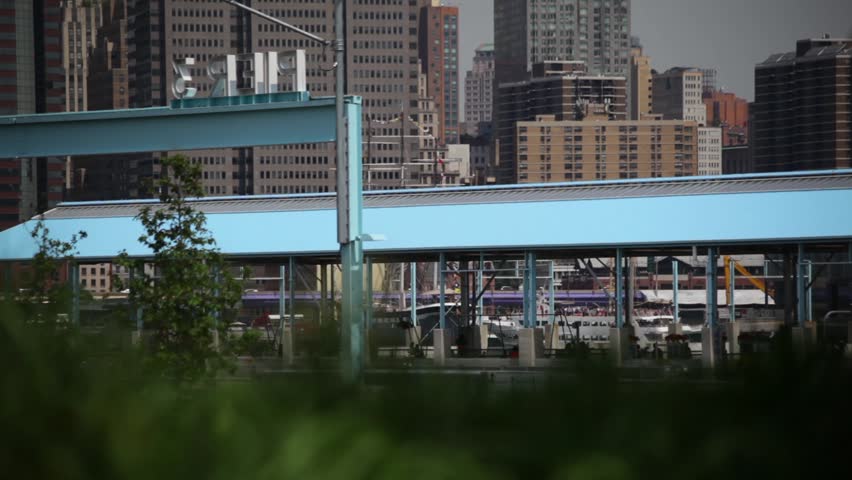 View of Manhattan from the Brooklyn Bridge Park in New York City on a sunny day.