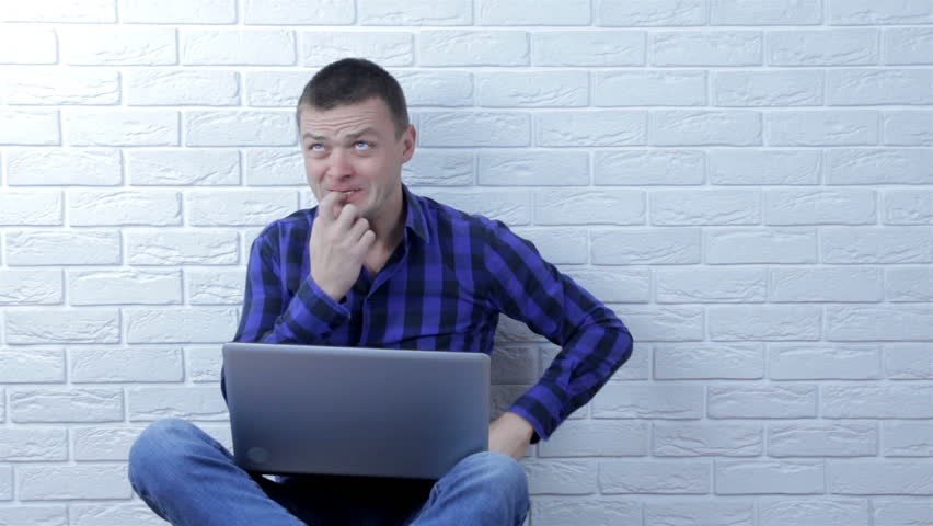 Confused young man pondering all the choices before making a decision | Shutterstock HD Video #1019242582