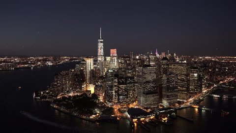New York City Circa-2015, aerial view of Lower Manhattan's Financial District at night and the East River, with Midtown Manhattan in the background