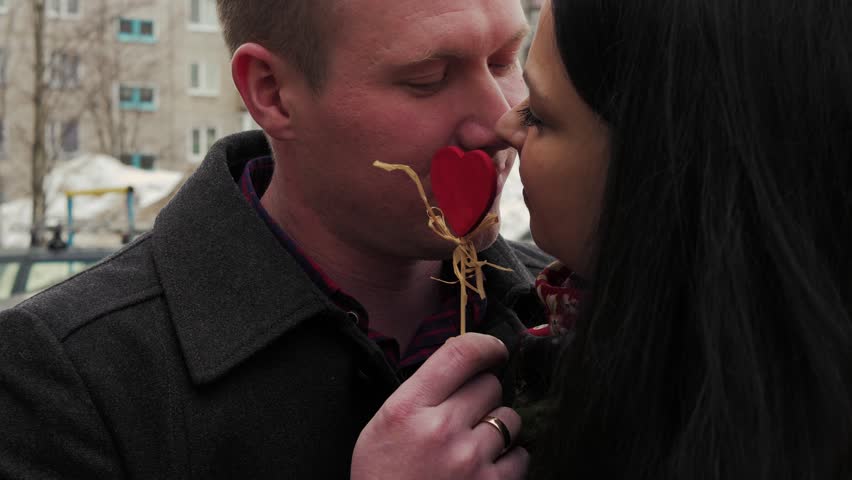 Romantic couple having a great time together in the couch at home
