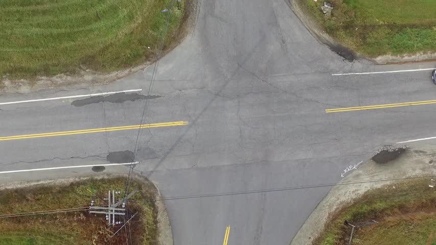 twisting bird's eye view rural intersection Stock Footage Video (100% ...