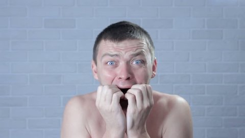Embarrassed naked man Stock Video Footage - 4K and HD Video Clips